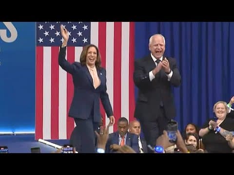 Kamala Harris and Tim Walz walk in together at rally in Pennsylvania