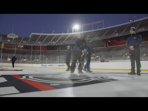 Crews painting lines on ice at Ohio Stadium in preparation for NHL Stadium Series game