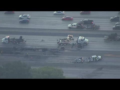 A police officer was hit near a crashed tractor-trailer