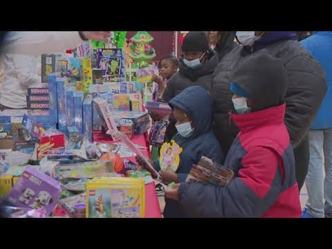 Santa gives out toys at rec center in Alexandria