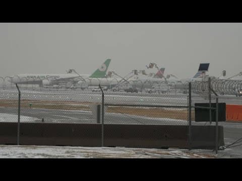 DFW Airport de-icing planes during North Texas winter storm