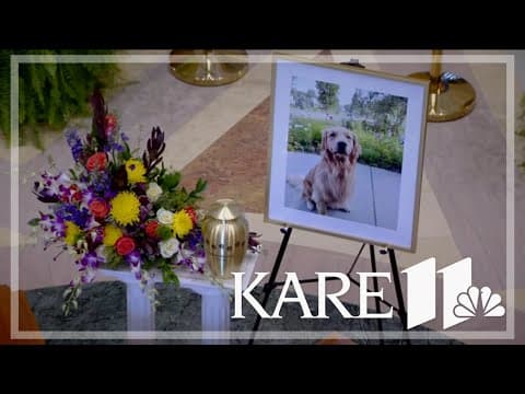 Gilbert's urn sits between Melissa and Mark Hortman's caskets as the first dog to lie in state