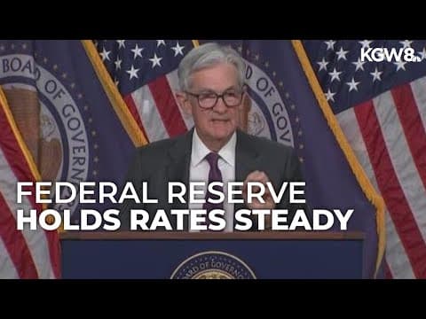 Federal Reserve holds rates steady, signals cuts ahead