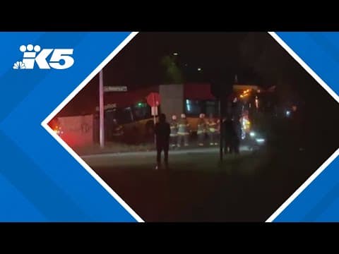 King County Metro bus dangles from embankment after driving through fence