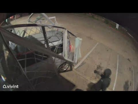 Thieves drive a car into a gun store, stealing a couple of knives