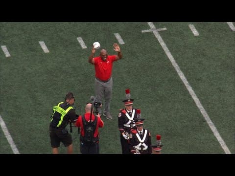 Archie Griffin dots the 'i' in Script Ohio during halftime of Ohio State season opener