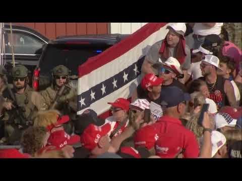 Trump 'fine' after being whisked off stage following apparent gunfire at rally