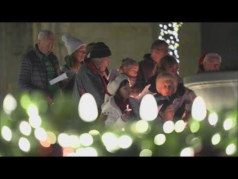 Fairview carolers take to town hall, raise awareness for legal fund in fight against proposed temple