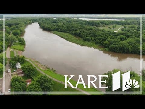 Minnesota River floods in Carver County, closing only road north