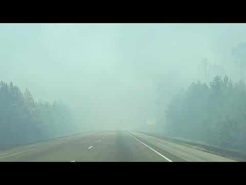 Fire crews continue fighting Mississippi grassfire forcing closure of Interstate 10