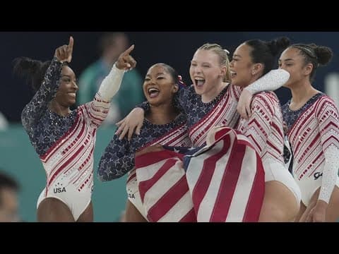 US women's gymnastics team celebrates winning gold