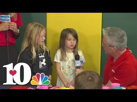 Lily and Regan learn how to make windsocks with the 10News Weather team