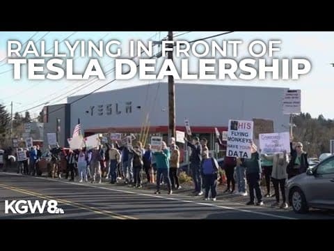 Protesters rally outside of Tigard Tesla dealership after vandalism