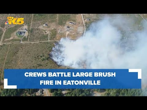 Aerials: Crews battle brush fire in Eatonville