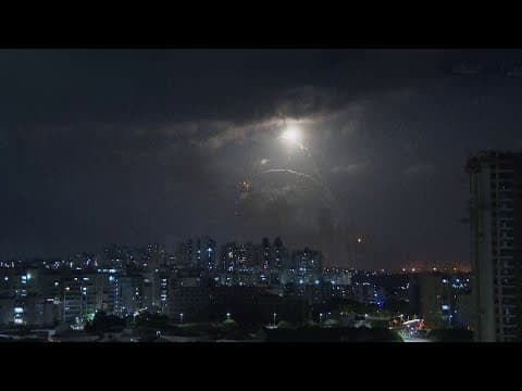 Sirens blare, rockets light up night sky in southern Israel amid war with Hamas