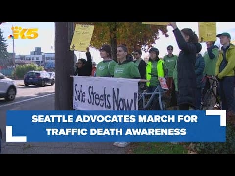 Community group marches along Seattle's Aurora Avenue for traffic death awareness