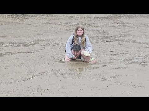 Heroic father jumps into action to save daughter from flooding school