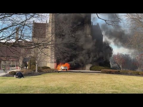 IMPD officers rescue woman from burning car after crash into north Indianapolis church