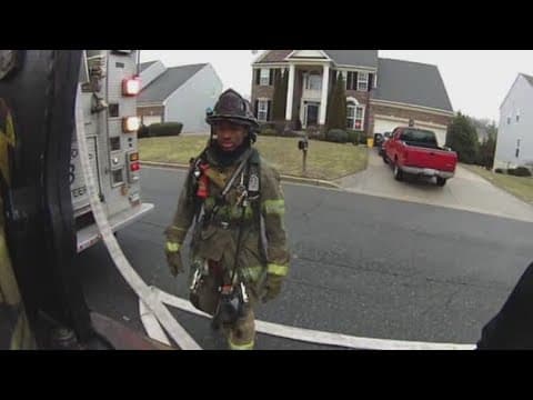 Off-duty volunteer firefighter rescues woman from burning car