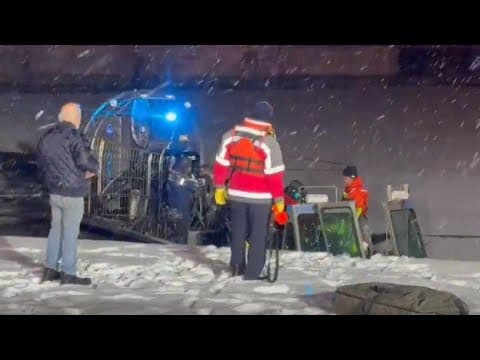 DC Fire and EMS divers rescue person from car submerged in freezing Potomac