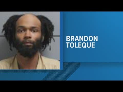 Powell man charged after body found inside home