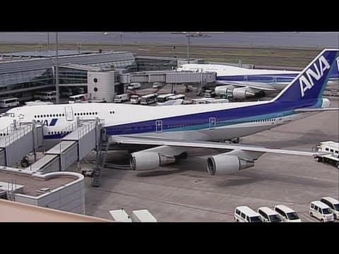 Passenger on plane tries to use exit door during flight