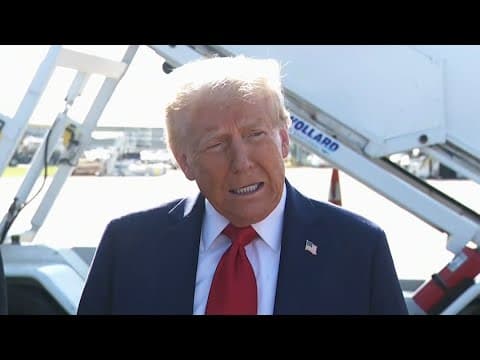 Donald Trump talks to media after landing in Michigan