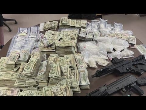Police: 2 in custody after officers seize drugs, guns and nearly $500,000 during operation