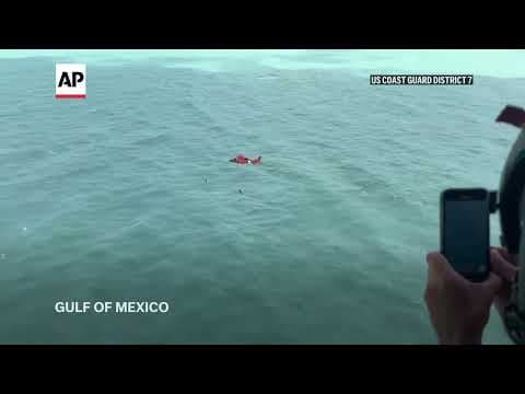US Coast Guard rescues a man clinging to an ice chest in the Gulf of Mexico