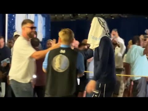 Luka Doncic daps up Travis Kelce after the Mavs beat Wolves 116-107 in Game 3