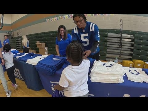 Colts players give out school uniforms, supplies to 580 students