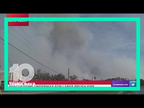 Fire rescue crews respond to a large brush fire in North Port