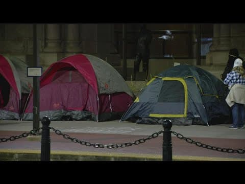 Dozens of protestors set up camp outside Minneapolis city hall