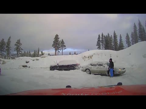 Man drives through snow-covered roads in California after storm