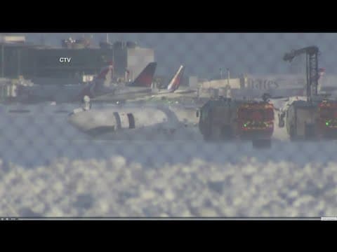 At least 15 injuries reported after plane flips over upon landing at Toronto airport
