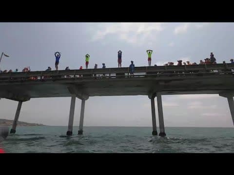 Junior Lifeguards jumping off Ocean Beach Pier to raise money for a great cause
