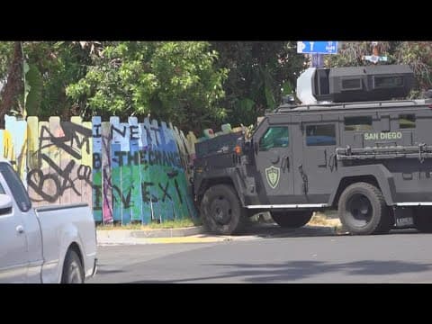 SWAT in standoff with armed man who allegedly threatened neighbor