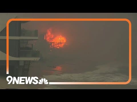 Wildfires burn out of control across Los Angeles area and kill 5 as thousands flee homes