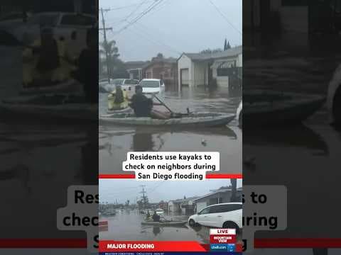 San Diego residents used kayaks along flooded roads in Mountain View to look for neighbors in need