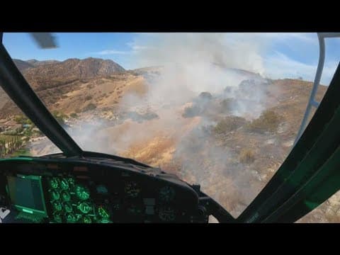 Behind the scenes look in the sky: Chopper drops water on Harbison Fire