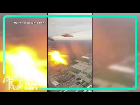 Flames seen outside airplane after engine fire, video shows
