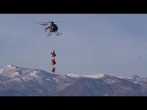 Wild deer fly through the air in Utah as part of a mission to fit them with GPS collars
