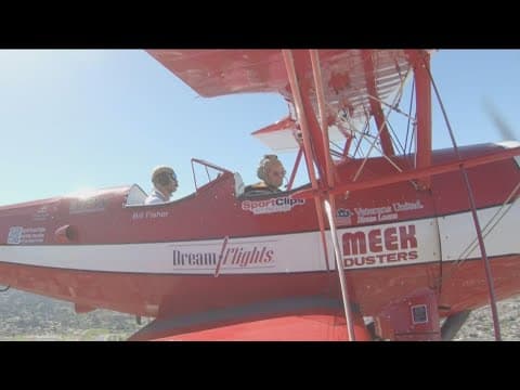 WWII Veterans treated to special flight in a restored, open-cockpit biplane
