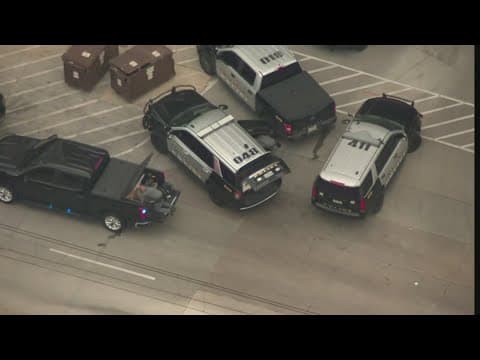 Road blocked off in Irving Friday afternoon as police search for shooting suspect