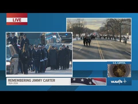 Jimmy Carter's casket marches toward U.S. Capitol