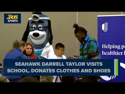 Seahawks' Darrell Taylor visits Seattle school to speak with students, gift them clothes and shoes