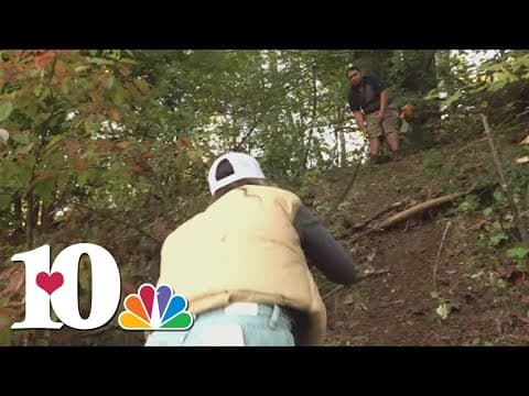 Fairview resident only able to reach his home up a steep embankment he carved after flood