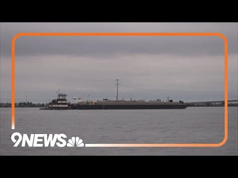 Ship passes through temporary channel near bridge wreckage site in Baltimore