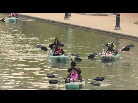 100 witches kayak down Indianapolis Canal for the Children's Museum haunted house opening week