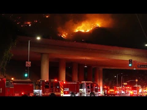 Firefighters battle to maintain the upper hand on a huge fire north of Los Angeles